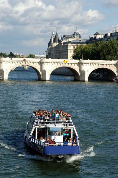 A boat on the Seine with Pont Neuf