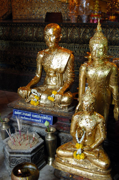 Statues with offerings of gold foil