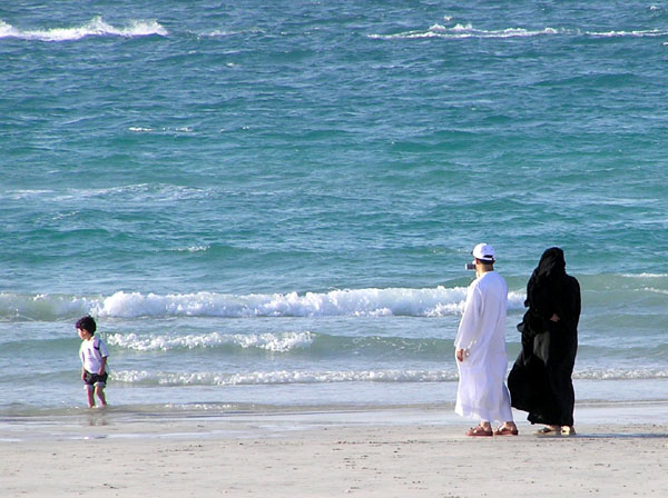 Local family along the beach in Dubai