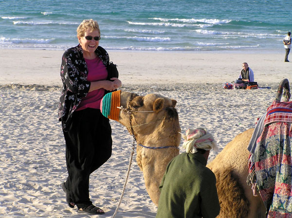 Mom and the camel on the beach