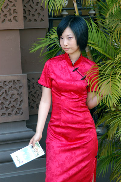 Woman in red silk dress