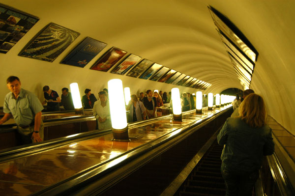 Taking the escalator down at Prospekt Mira station