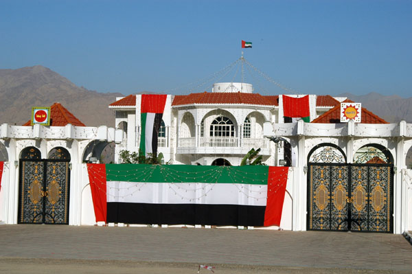 House in Dibba festively decorated in the UAE flag