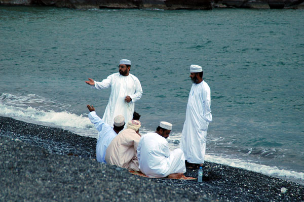 A group of Omani men enjoying the beach