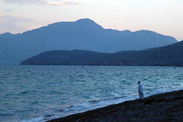 Lone Omani man on the beach near Khaseb in the evening