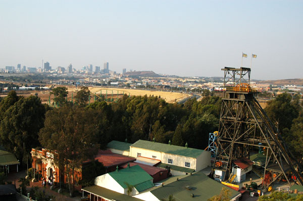 Downtown Johannesburg in the distance with the Shaft 14 tower, Gold Reef City