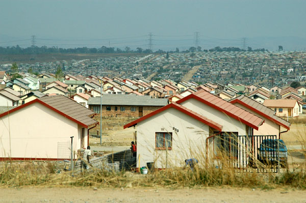 In this community alone, Mid City Village, just south of the squatter camp shown above, are thousands of new homes