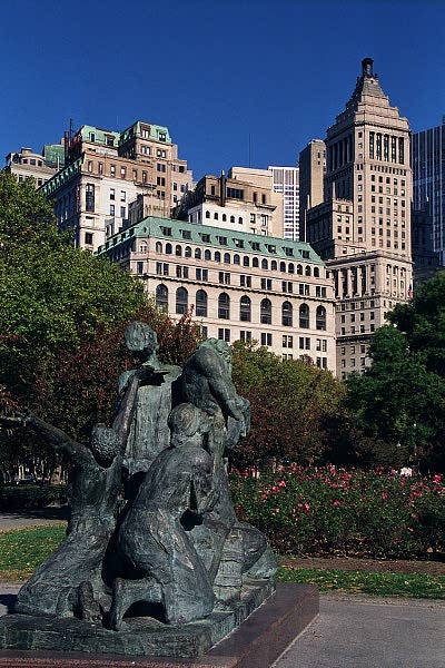 Immigrants Memorial, Battery Park, with Standard Oil Building