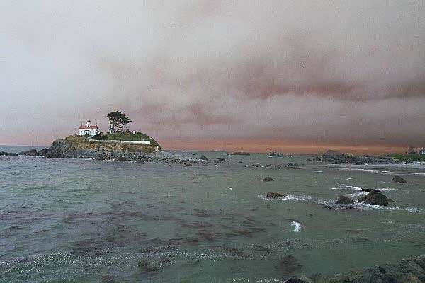 Lighthouse off Crecent City, California with the smoke of huge Oregon forest fires