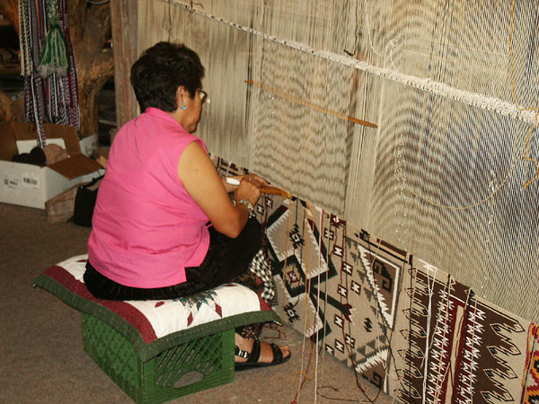 Navajo woman weaving a carpet, Cameron, AZ