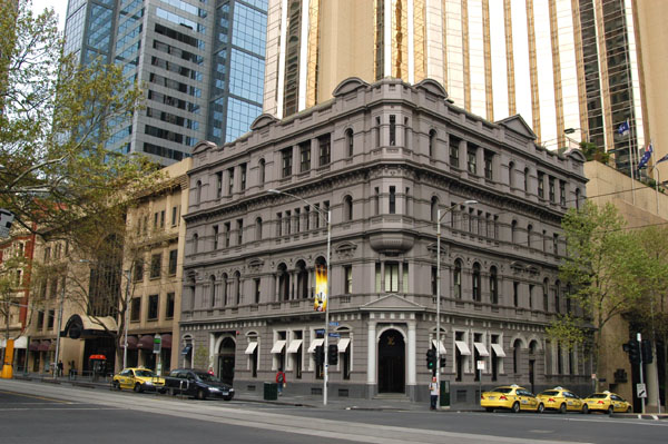 Many of Melbournes skyscrapers are hidden away behind the old facades, here Collins & Russell Sts.