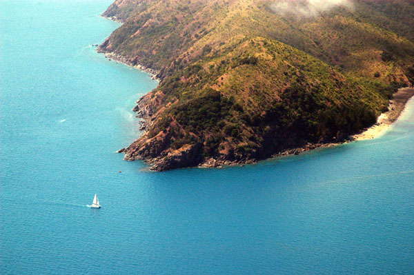 Sailboat off the tip of North Molle Island in the Whitsundays