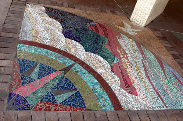 On each corner of Victoria Street at Wood St is a quarter circle mosaic Horizons