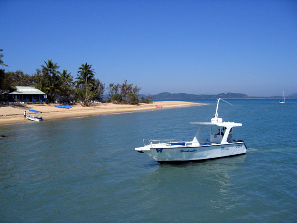 Small boat off the beach at Dunk Island, near Mission Beach