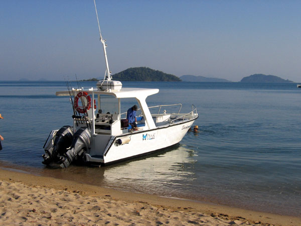 Boat pulled up to the beach on the south side of Dunk Island