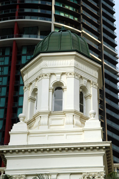 Old building dwarfed by the high rises on Eagle Street