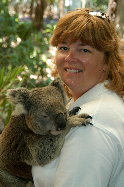 Debbie with a koala, very excited (not the koala)