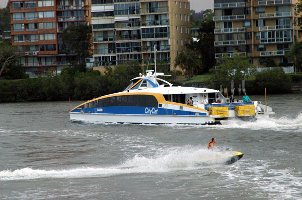 A jetski and a CityCat on the Brisbane River