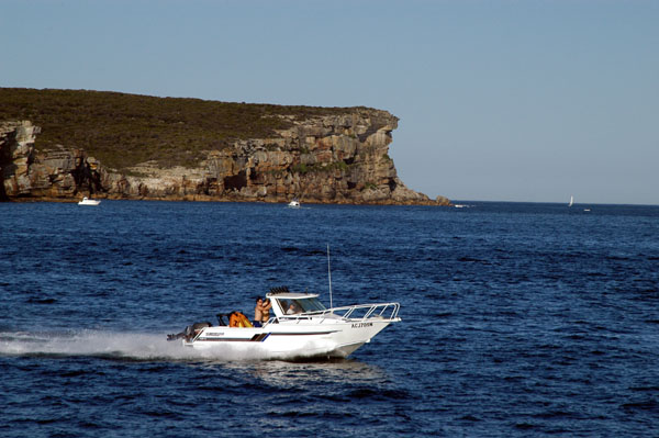Motor boat passing North Head