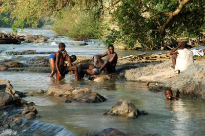 Men bathing at Epupa Falls