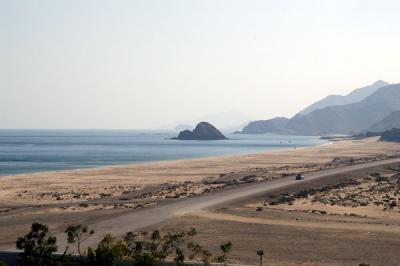 View looking south from Al Aqah with Snoopy Island (Jazirat Al Ghubbah)