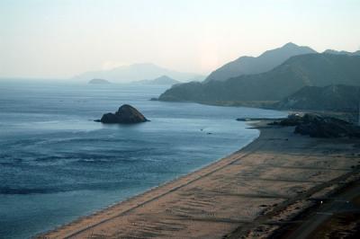 View looking south from Al Aqah with Snoopy Island (Jazirat Al Ghubbah)