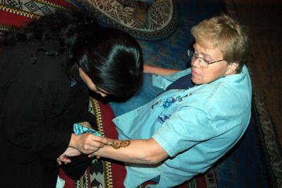 Mom getting a henna tattoo