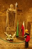 Polish boy looking at the John Paul II statue