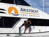 Crewmember scrubbing down the Aristocat