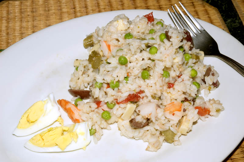 italian style rice salad with cheese, shrimp, peas, pickles, olives, tuna