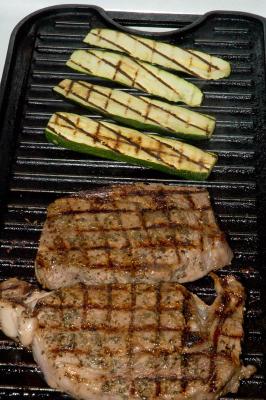 steaks and zucchini grilling
