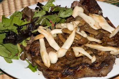 porterhouse steak, sauteed beech and honey mushrooms, mesclun salad with sauteed black trumpet chanterelle mushrooms