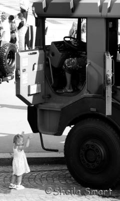Little girl with armoured vehicle