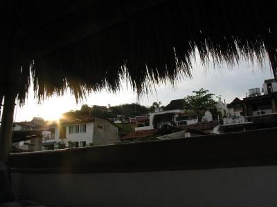 Sun rise from the back of the roof-top Palapa