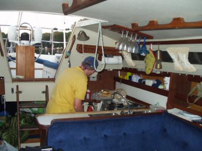 At anchor, the ship's captain in the galley