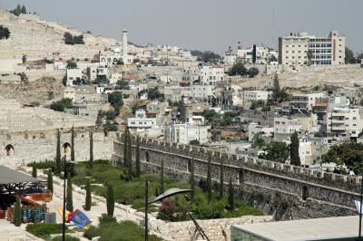 Old City wall with newer parts of Jerusalem in the background