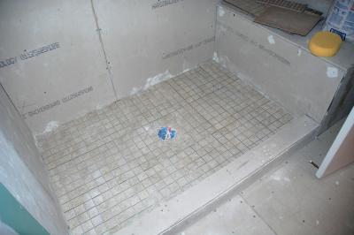 Day 8:  Shower floor has been tiled