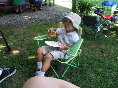Kyle eating a hot dog at Samantha B-day party