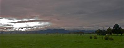 Green Pasture under Monochrome Sky by Gilles