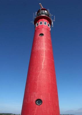 Red Lighthouse: Blue Sky by Roger Wilmot