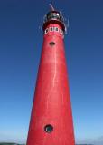 Red Lighthouse: Blue Sky by Roger Wilmot