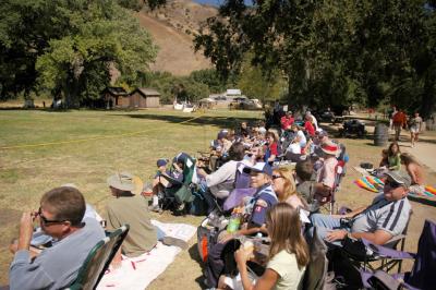 The audience watches the battle