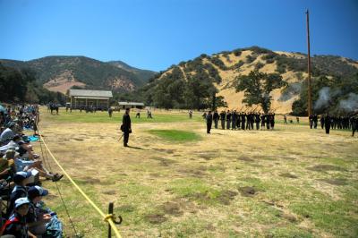 Spectators watch the Yankees fire their rifles