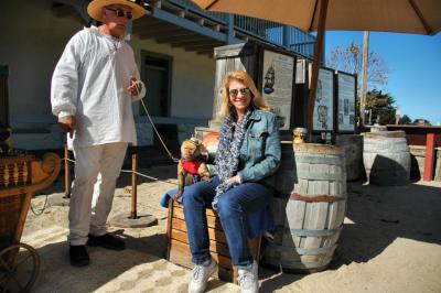 Laurie befriends a trained monkey on Fisherman's Wharf, Monterey