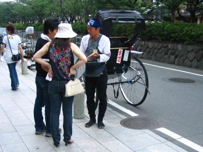 Rickshaw driver and potential customers
