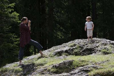 Sarah taking photo of Jemima on rock