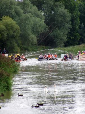 Swans leading the start of the Sandwich Fest Raft Race